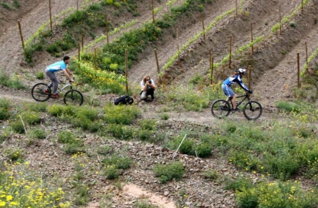  a photographer photographing two cyclists